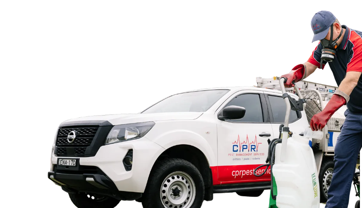 CPR Pest Management technician preparing a sprayer beside the service ute